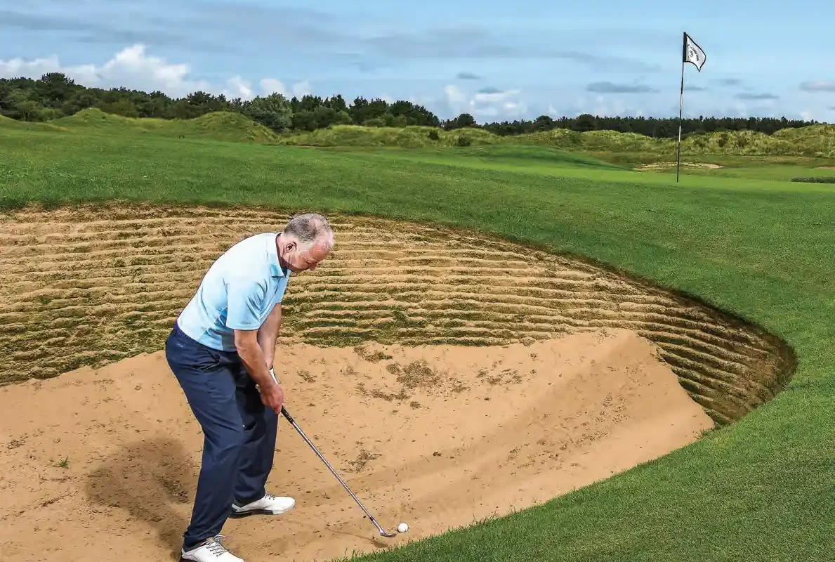 SHORT BUNKERSHOT TO A TIGHT PIN