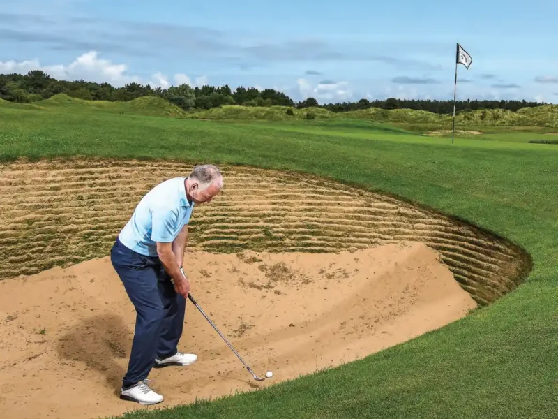 SHORT BUNKERSHOT TO A TIGHT PIN